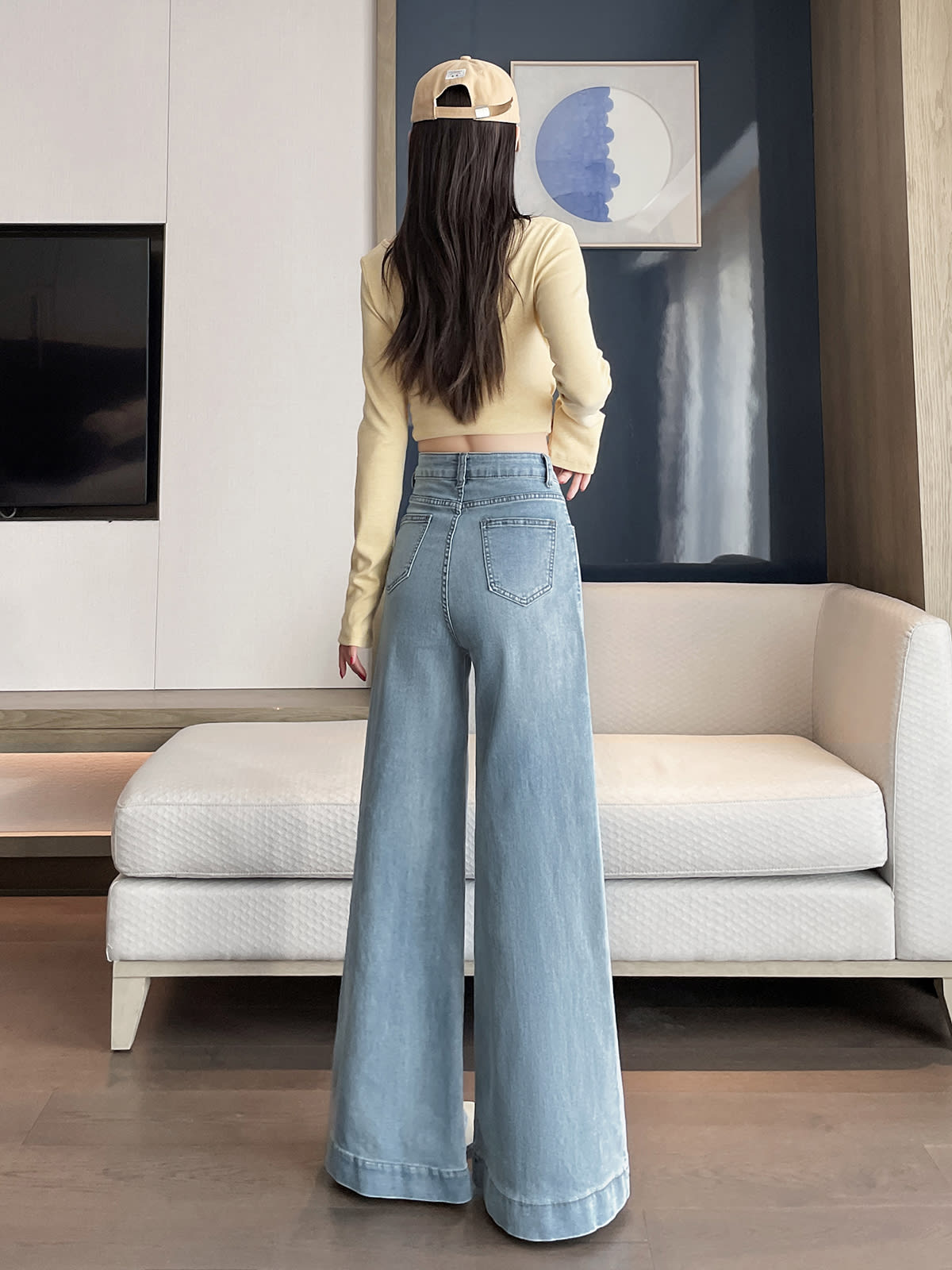 YEEYEEWang wide-leg jeans in light wash blue, Asian-fit cut, back lifestyle view on model.