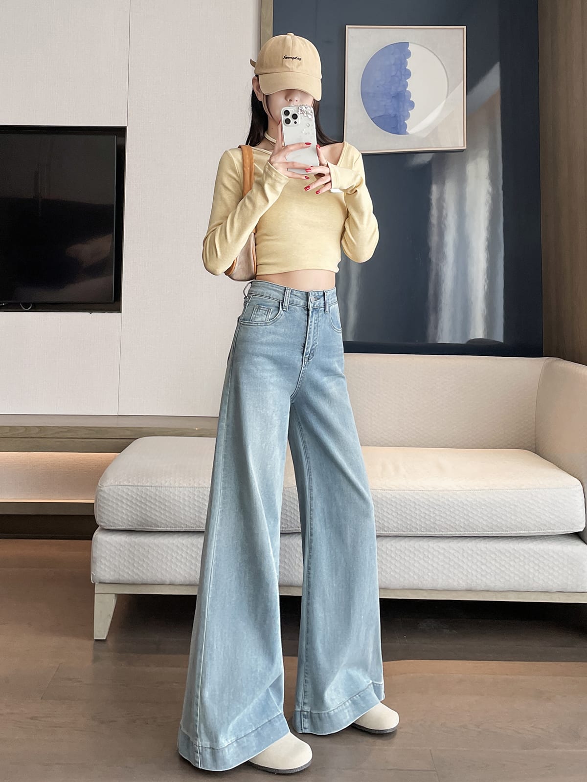 YEEYEEWang wide-leg jeans in light wash blue, Asian-fit cut, dynamic pose showing drape.