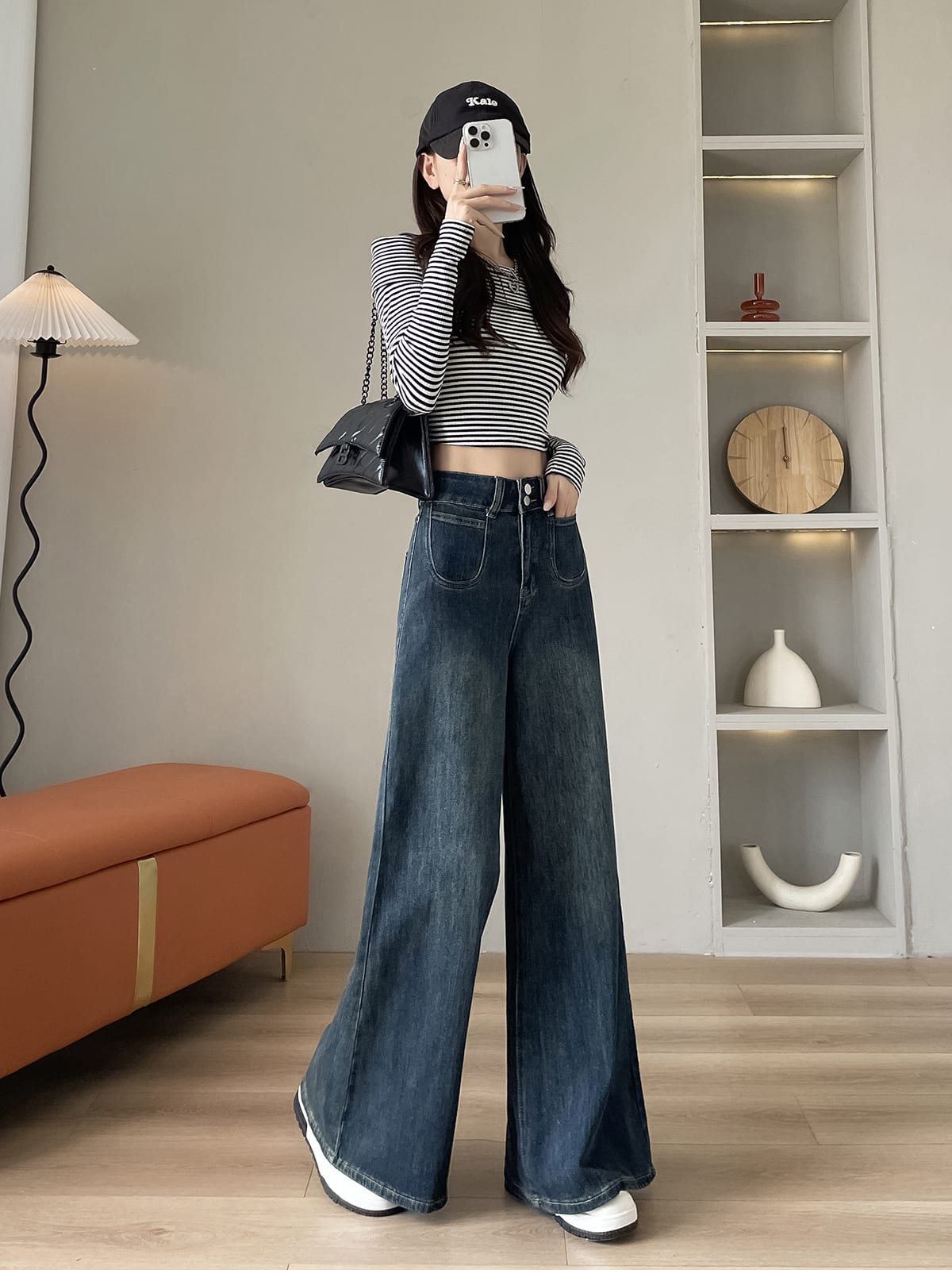 YEEYEEWang wide-leg jeans in mid-wash blue, Asian-fit cut, dynamic pose showing fluid drape.