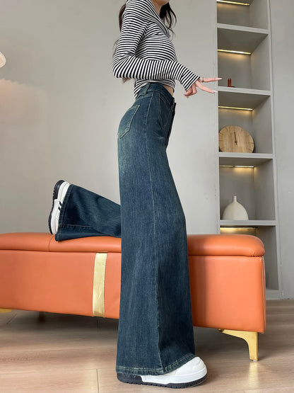 YEEYEEWang wide-leg jeans in mid-wash blue, Asian-fit cut, model sitting pose highlighting wide hem drape.