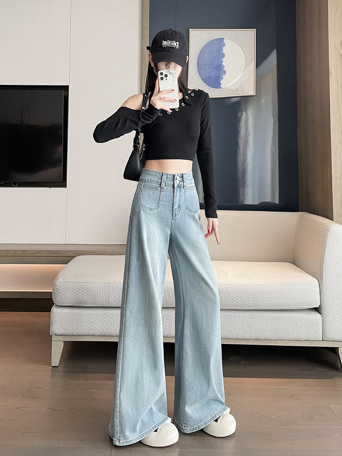 YEEYEEWang wide-leg jeans in light wash blue, Asian-fit cut, dynamic pose showing fluid drape.