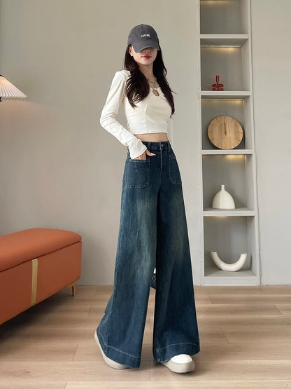 YEEYEEWang wide-leg jeans in mid-wash blue, Asian-fit cut, dynamic pose showing drape.