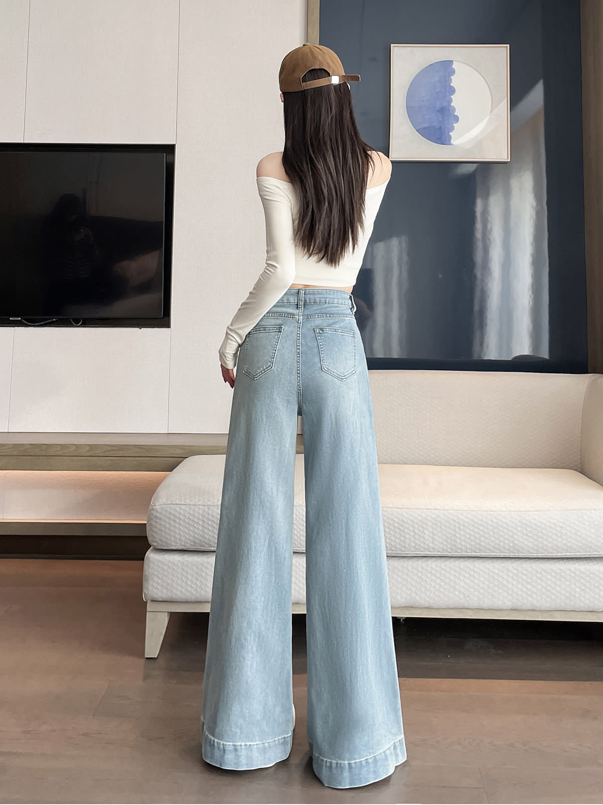 YEEYEEWang wide-leg jeans in light wash blue, Asian-fit cut, back lifestyle view on model.