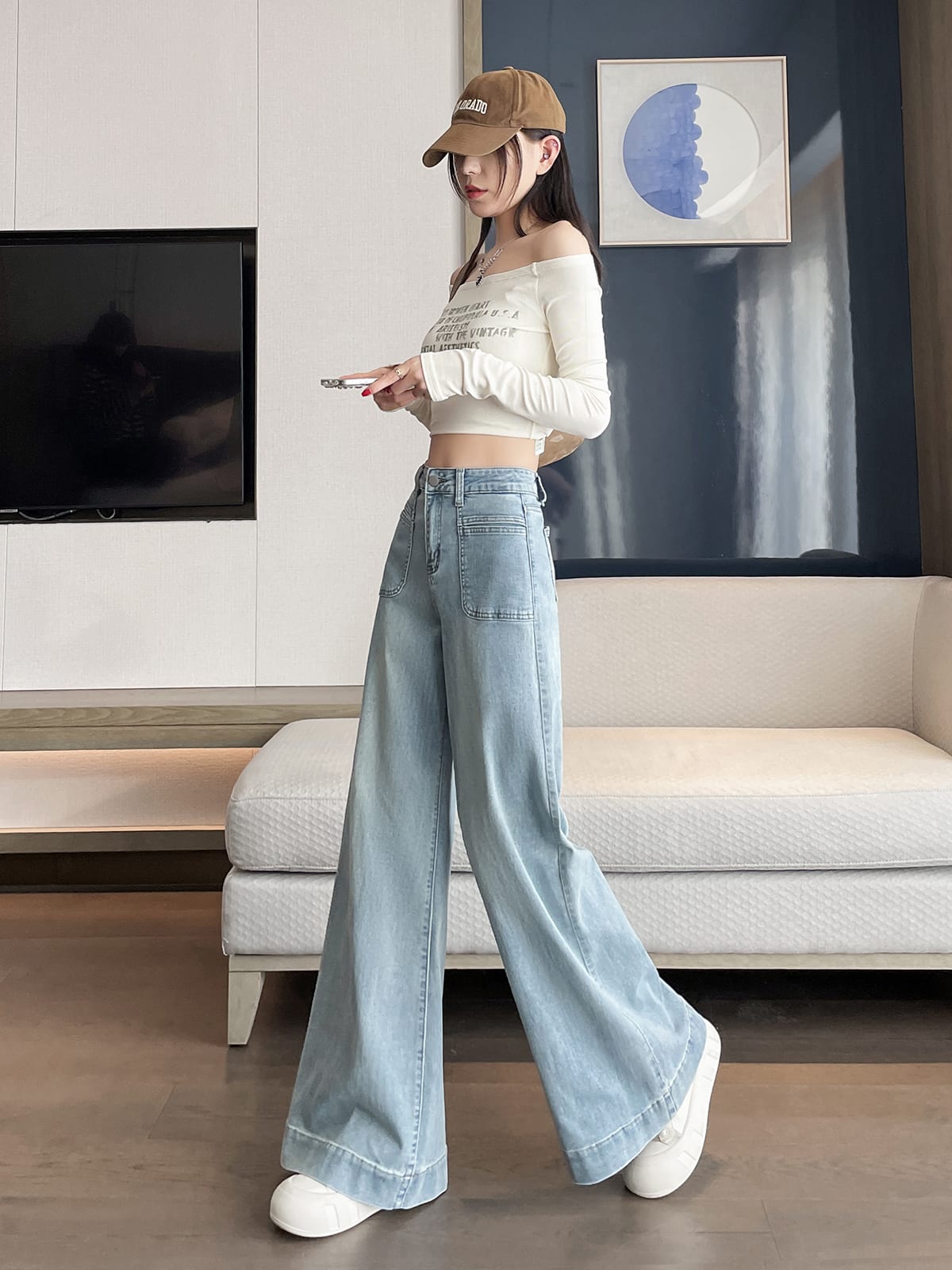 YEEYEEWang wide-leg jeans in light wash blue, Asian-fit cut, dynamic pose showing drape.
