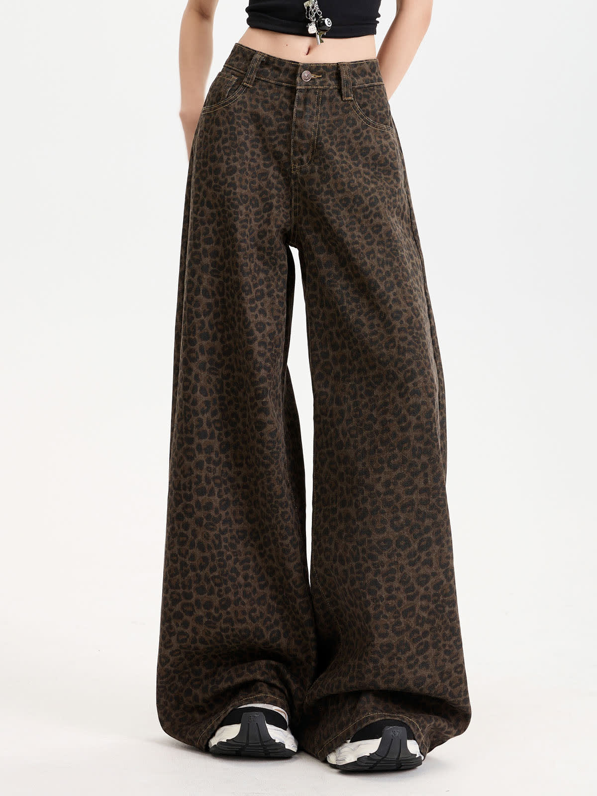 YEEYEEWang Wide-Leg Jeans in Leopard Print, Asian-fit cut, waist-down front view standing in a black crop top and sneakers, variant thumbnail.