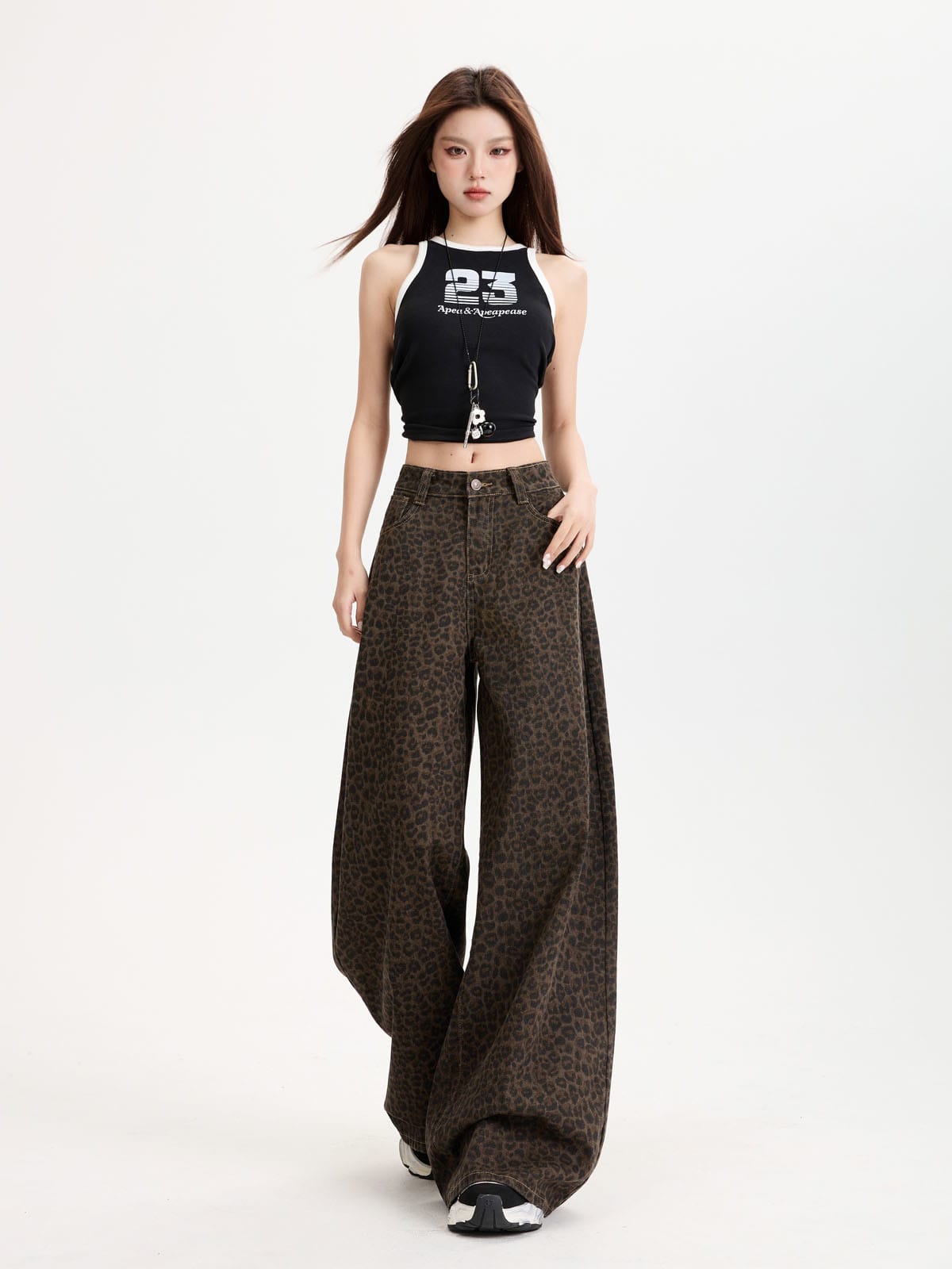 YEEYEEWang Wide-Leg Jeans in Leopard Print, Asian-fit cut, full-body front view standing in a black tank top with one hand resting at the pocket.