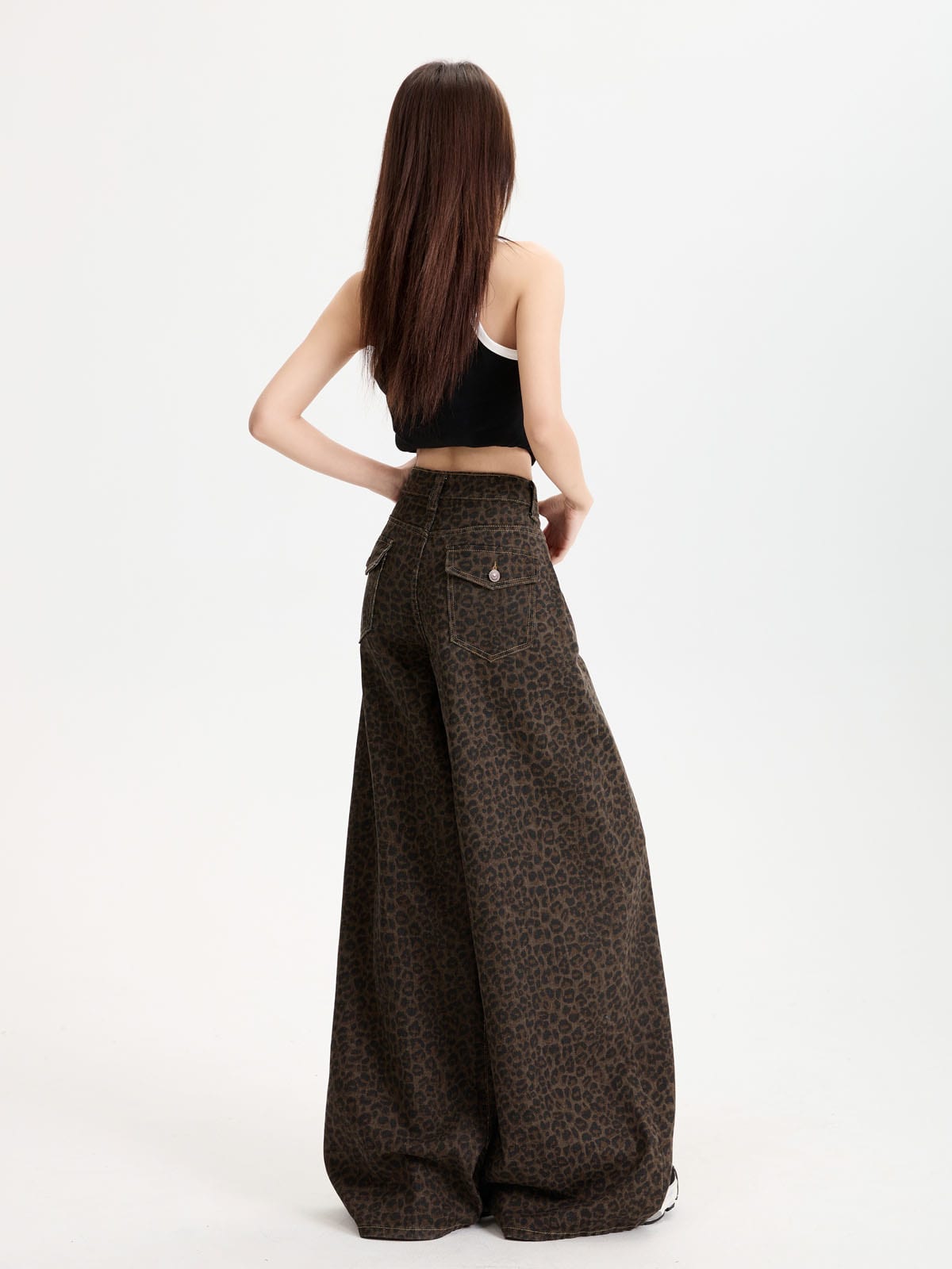 YEEYEEWang Fleece-Lined Wide-Leg Jeans in Leopard Print, Asian-fit cut, full-body back view with hand resting on waistband, buttoned back patch pocket.
