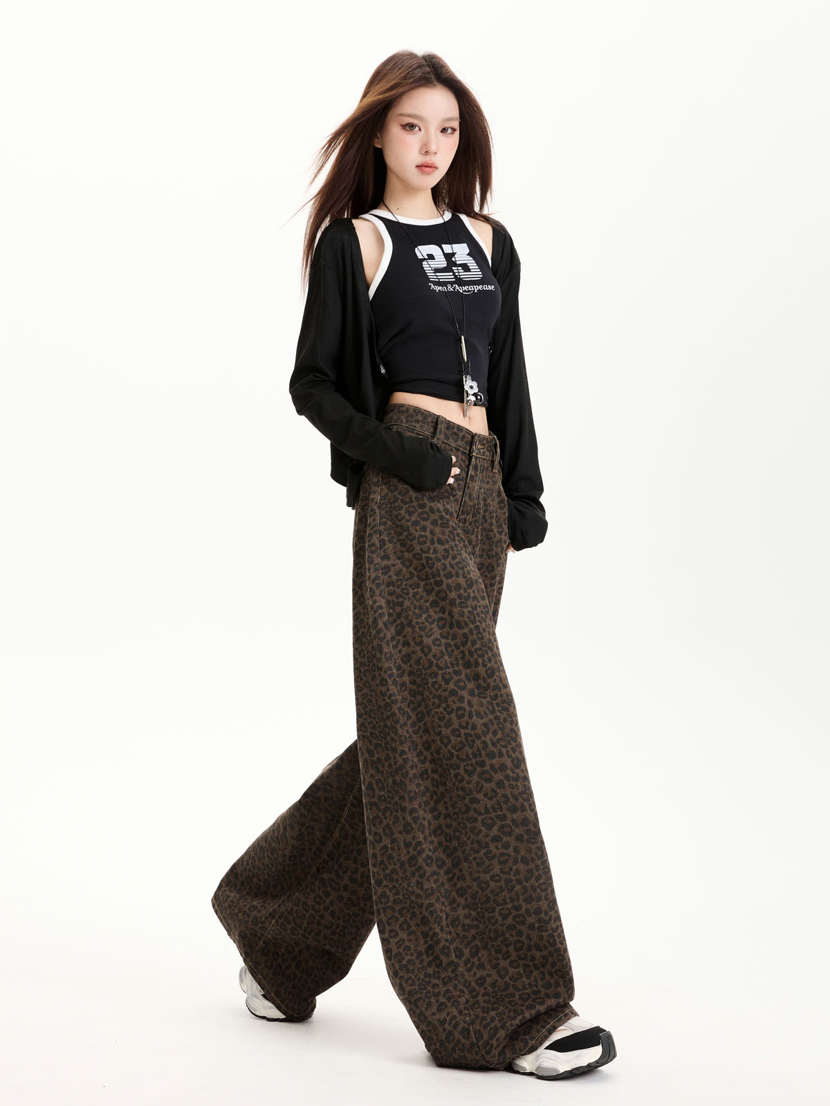 YEEYEEWang Fleece-Lined Wide-Leg Jeans in Leopard Print, Asian-fit cut, full-body walking pose, black cardigan over tank top.