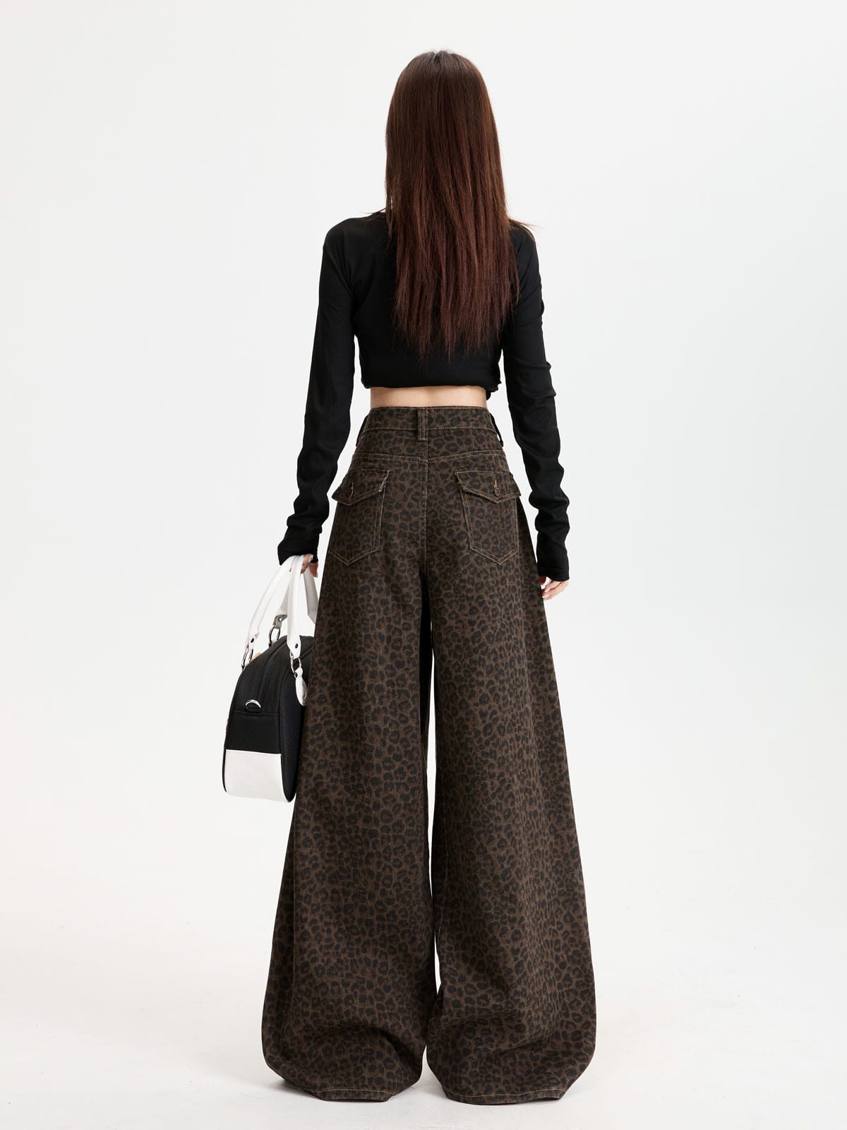 YEEYEEWang Fleece-Lined Wide-Leg Jeans in Leopard Print, Asian-fit cut, full-body back standing pose holding a black-and-white handbag, black long-sleeve top.