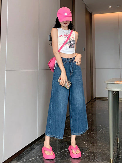 YEEYEEWang Wide-Leg Jeans in Vintage Blue, Asian-fit cut, full-body front standing pose, one hand in front pocket, other hand holding phone, pink cap and crossbody bag.