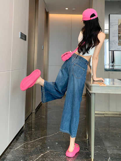 YEEYEEWang Wide-Leg Jeans in Vintage Blue, Asian-fit cut, full-body back view leaning on table with one leg kicked up, back patch pockets visible.
