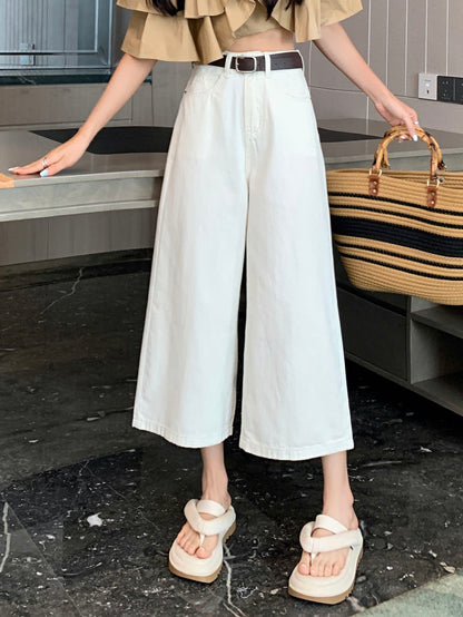 YEEYEEWang Wide-Leg Jeans in Ivory, Asian-fit cut, waist-down front view with black belt and straw tote bag, variant thumbnail.