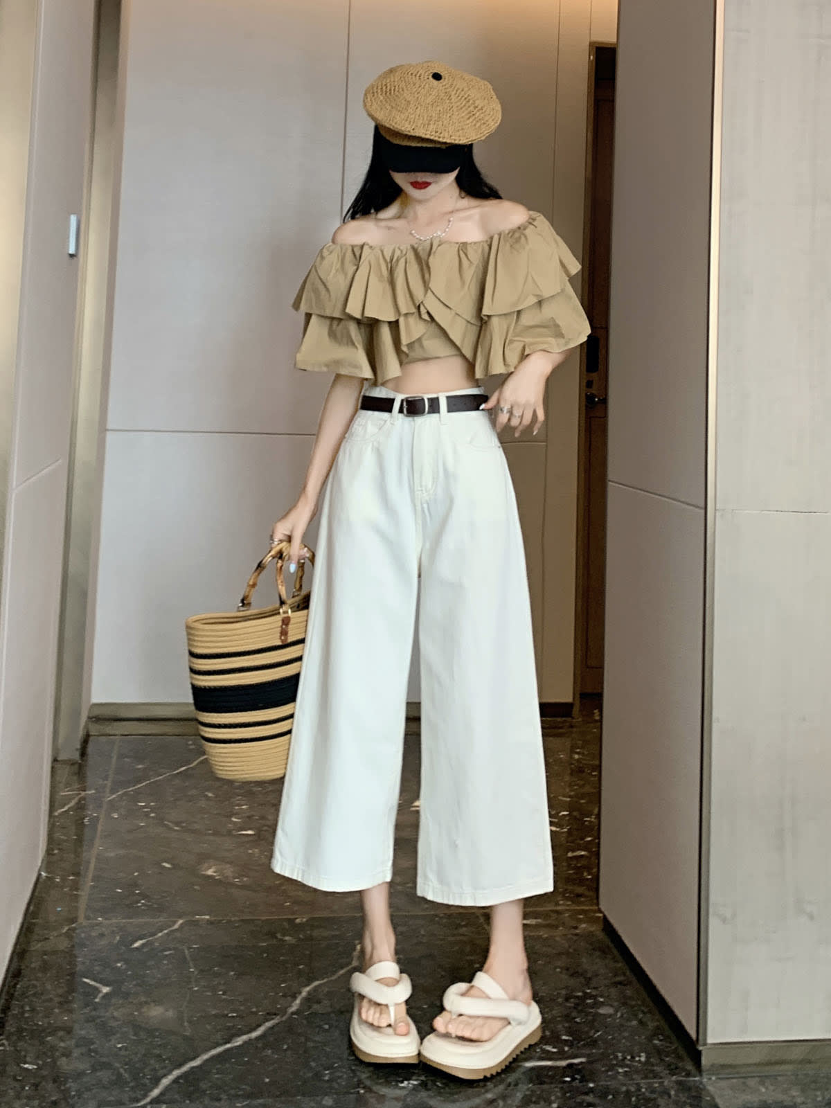 YEEYEEWang Wide-Leg Jeans in Ivory, Asian-fit cut, full-body front standing pose holding straw tote, off-shoulder ruffle top and straw cap.