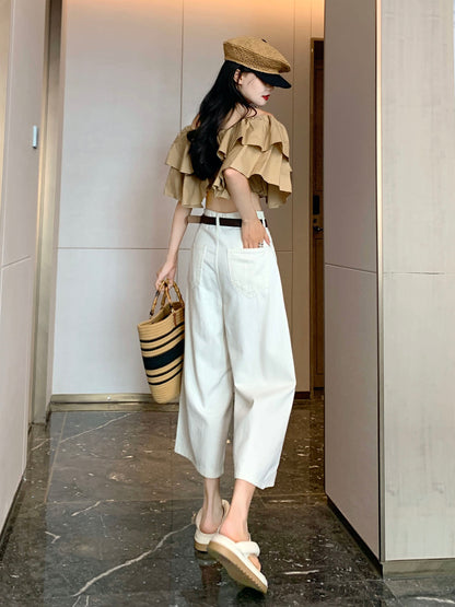 YEEYEEWang Wide-Leg Jeans in Ivory, Asian-fit cut, full-body back-side walking view holding straw tote, back patch pockets and black belt visible.