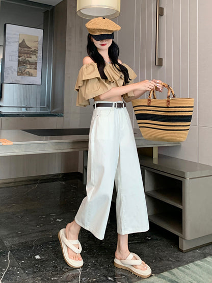 YEEYEEWang Wide-Leg Jeans in Ivory, Asian-fit cut, full-body front standing pose holding striped straw tote with both hands, woven cap and visor.