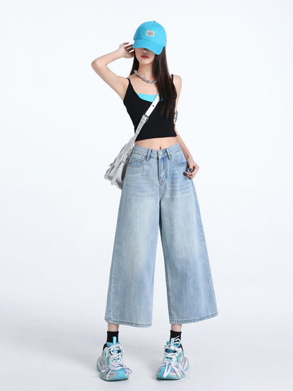 YEEYEEWang Wide-Leg Jeans in Light Blue, Asian-fit cut, full-body front pose with one hand touching cap brim, silver crossbody bag at hip.