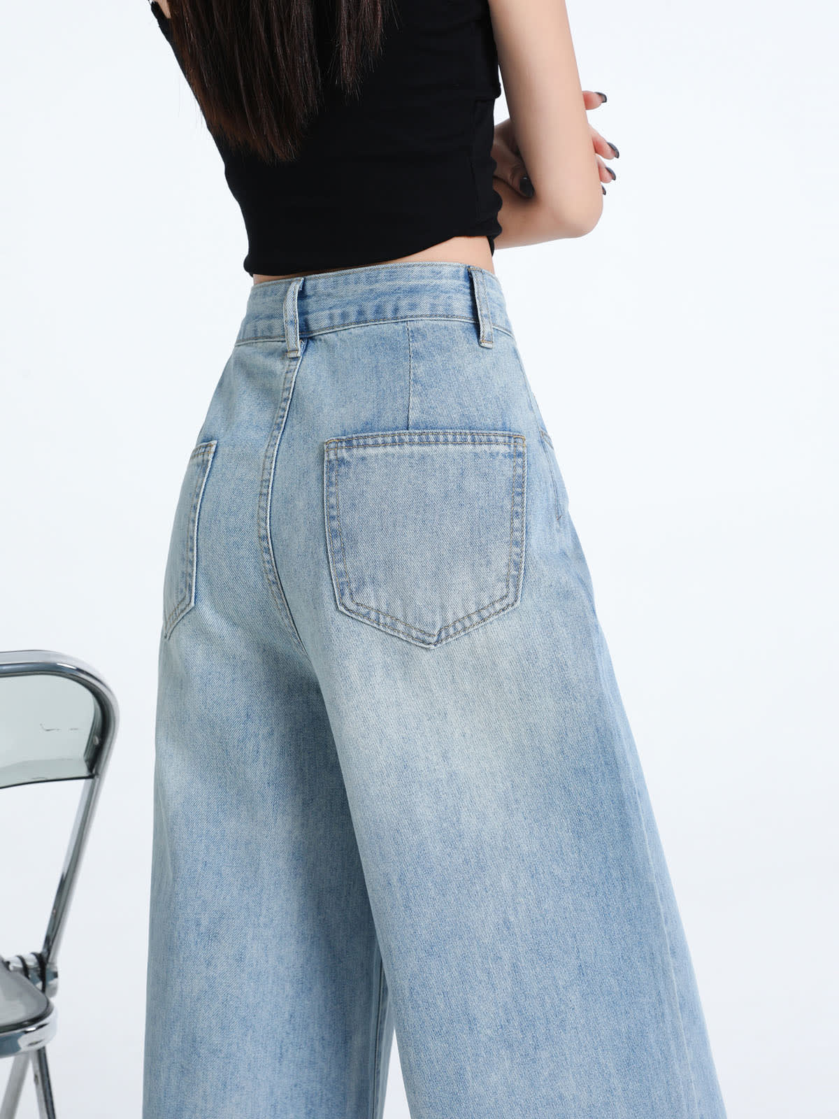 YEEYEEWang Wide-Leg Jeans in Light Blue, Asian-fit cut, waist-down back close view showing pointed back patch pockets and clean stitching.