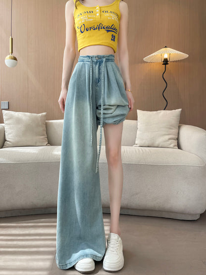 YEEYEEWang Wide-Leg Jeans in Light Blue, Asian-fit cut, full-body standing pose with one pant leg pulled up to the thigh showing the wide leg opening, white sneakers visible.