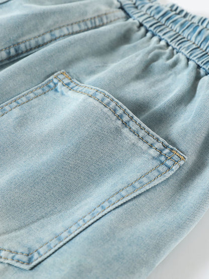 YEEYEEWang Wide-Leg Jeans in Light Blue, Asian-fit cut, close-up of back patch pocket with double topstitching under elastic waistband.