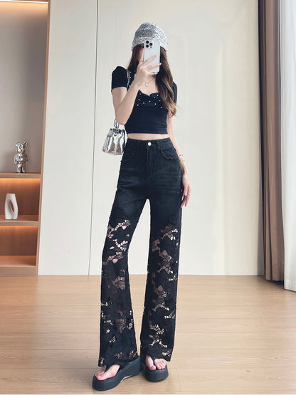 YEEYEEWang Wide-Leg Jeans in Solid Black, Asian-fit cut, full-body front standing pose holding phone at face, rhinestone-trim waistband and pockets, silver bag on shoulder.
