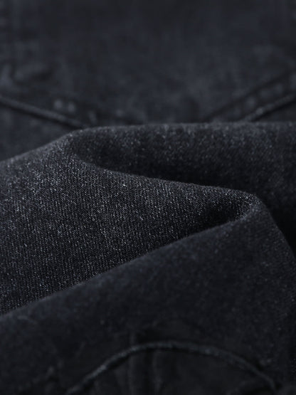 YEEYEEWang Wide-Leg Jeans in Solid Black, Asian-fit cut, close-up of softly folded dark denim fabric showing fine twill texture and subtle sheen.