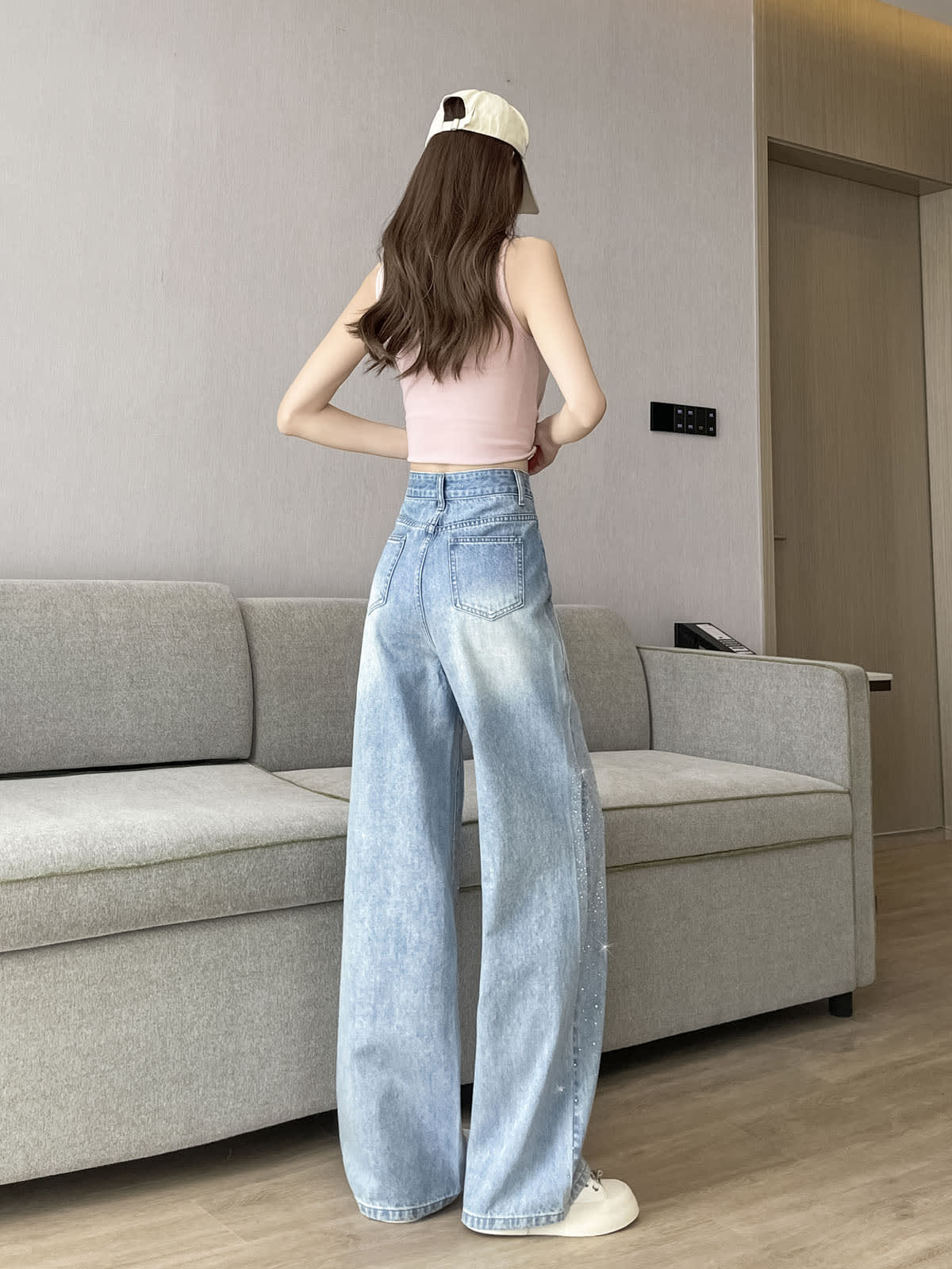 YEEYEEWang Wide-Leg Jeans in Light Blue, Asian-fit cut, full-body back view standing pose, back patch pockets and washed light blue denim with subtle sparkle.