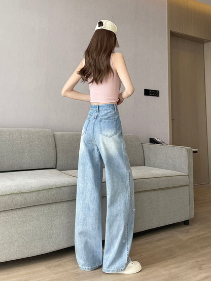 YEEYEEWang Wide-Leg Jeans in Light Blue, Asian-fit cut, full-body back view standing pose, back patch pockets and washed light blue denim with subtle sparkle.