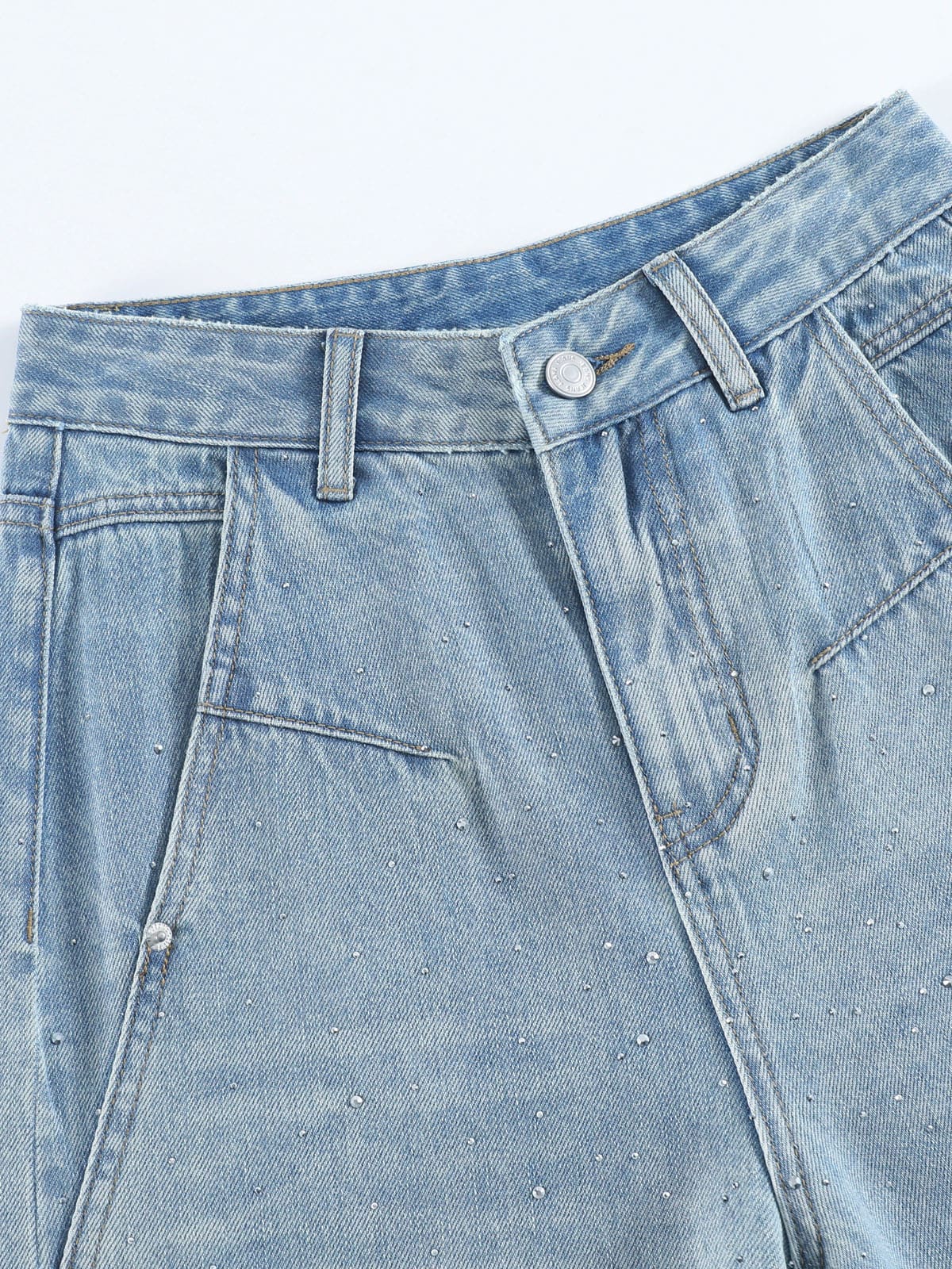 YEEYEEWang Wide-Leg Jeans in Light Blue, Asian-fit cut, close-up of high-rise waistband with silver-tone button, belt loops and rivets on rhinestone-dusted denim.