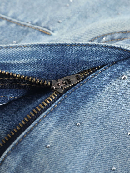 YEEYEEWang Wide-Leg Jeans in Light Blue, Asian-fit cut, close-up of fly with antique bronze zipper on faded denim, scattered rhinestones nearby.