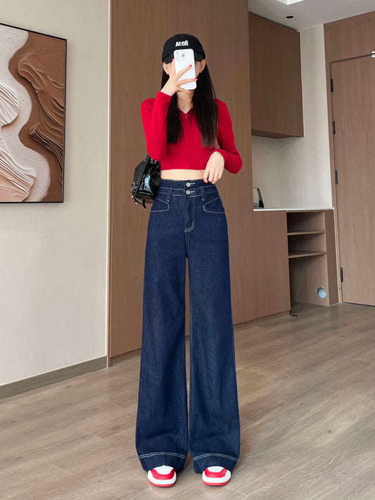 YEEYEEWang Wide-Leg jeans in Denim Blue, Asian-fit cut, full-body front pose holding phone at face, black cap and black bag.