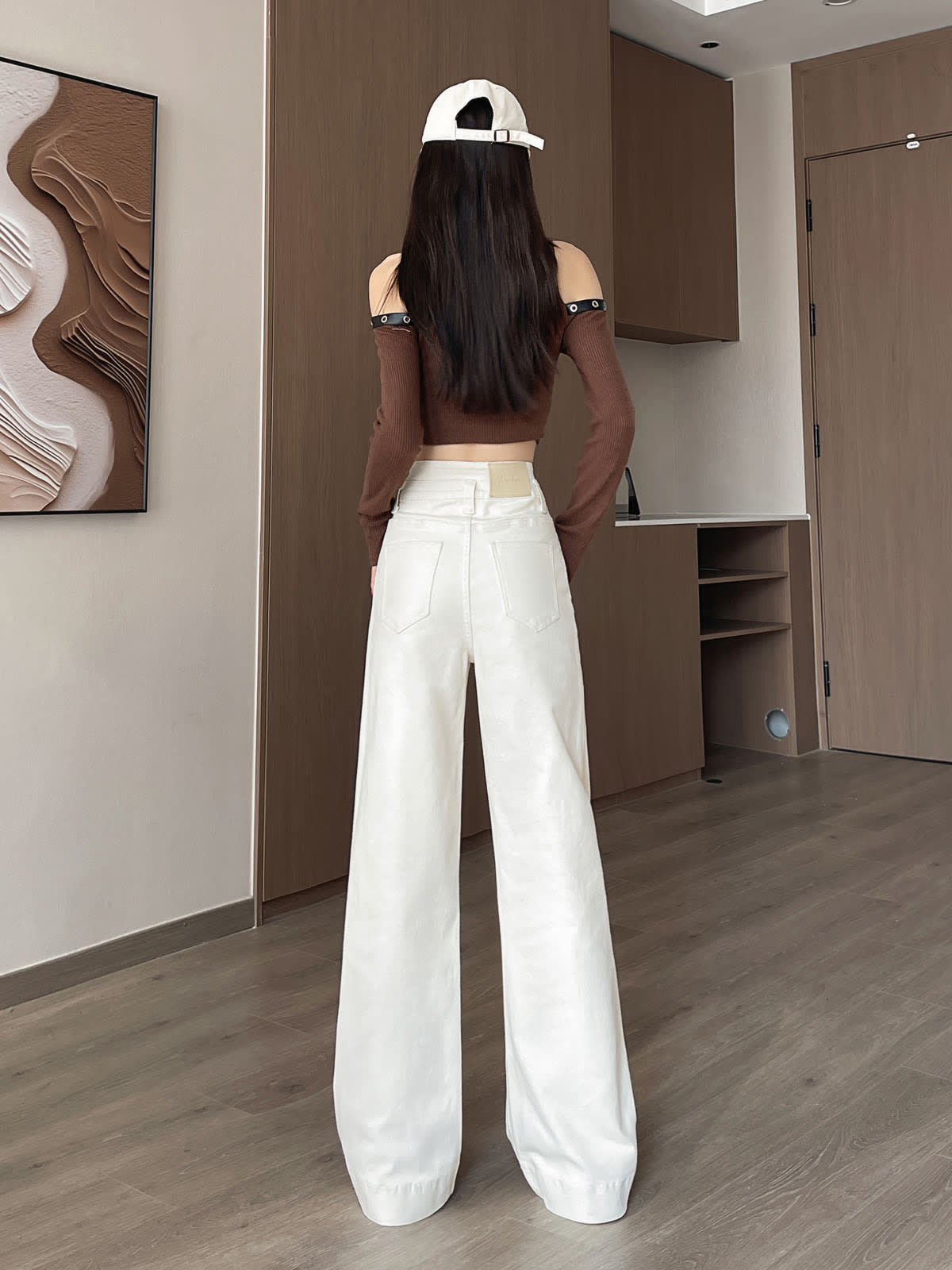 YEEYEEWang Wide-Leg jeans in Ivory, Asian-fit cut, full-body back view showing back patch pockets and leather patch, white cap.