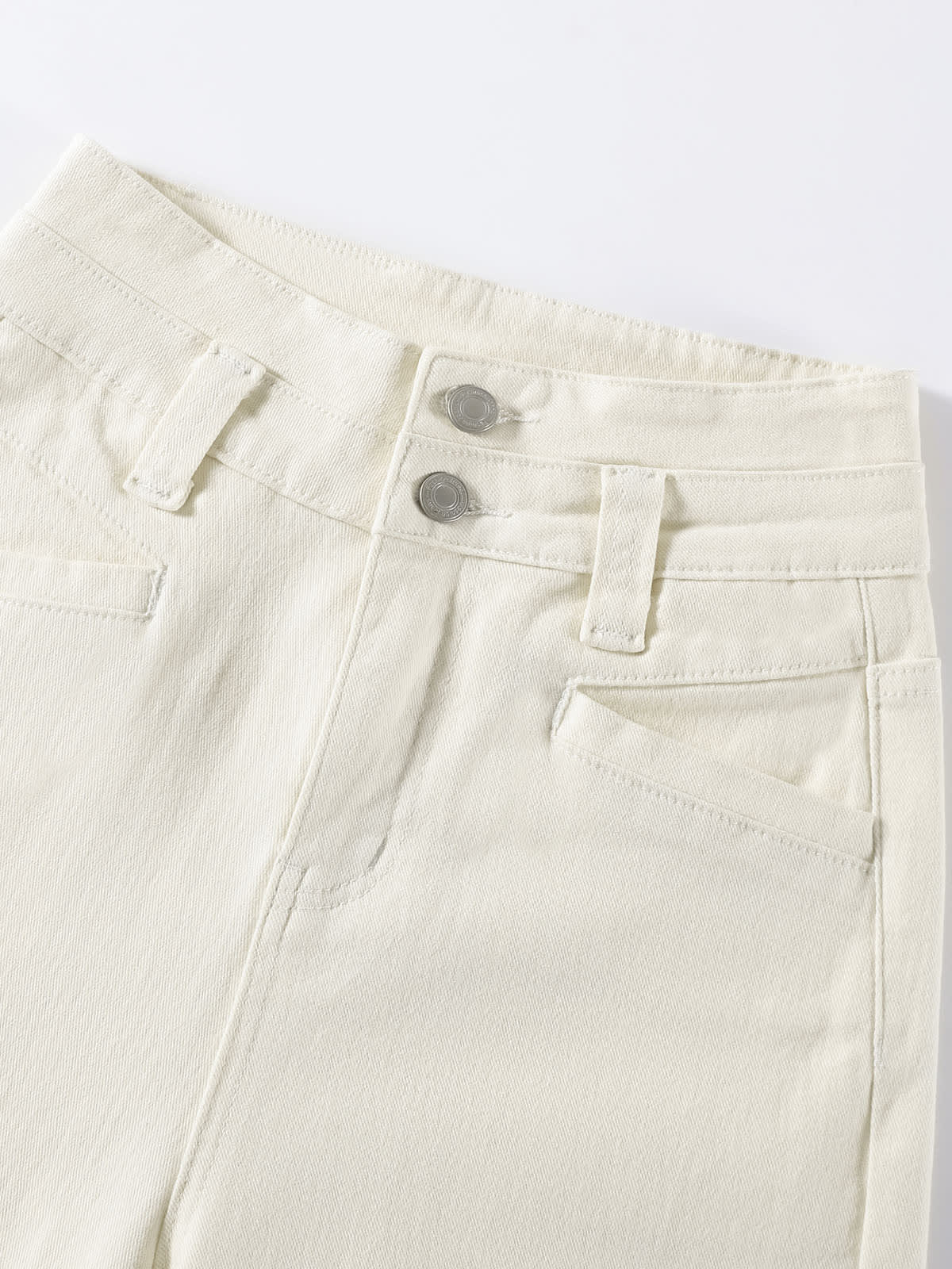 YEEYEEWang Wide-Leg jeans in Ivory, Asian-fit cut, close-up of waistband with silver-tone double buttons and tonal stitching.