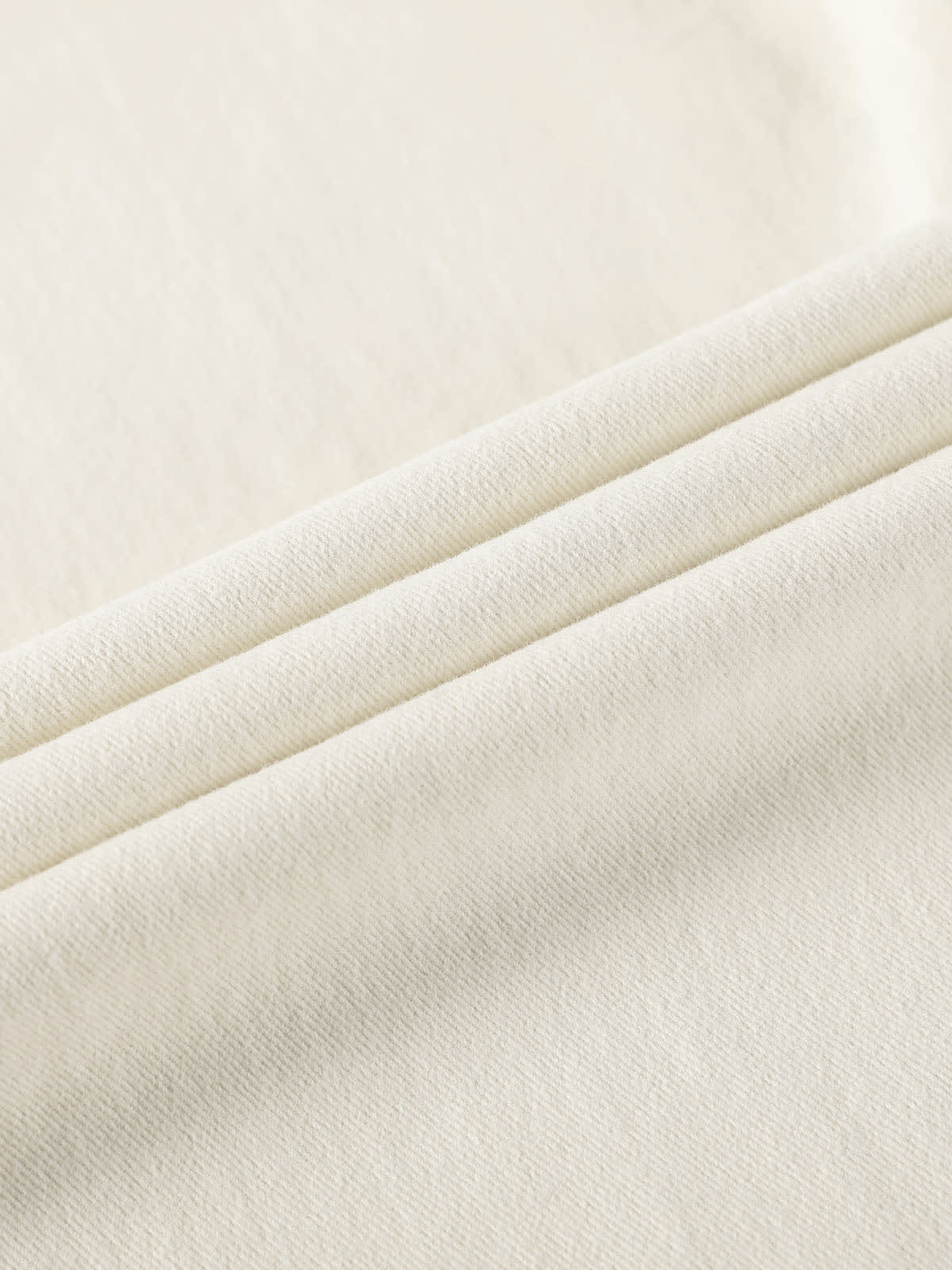 YEEYEEWang Wide-Leg jeans in Ivory, Asian-fit cut, close-up of soft fabric texture with fine twill weave and natural folds.