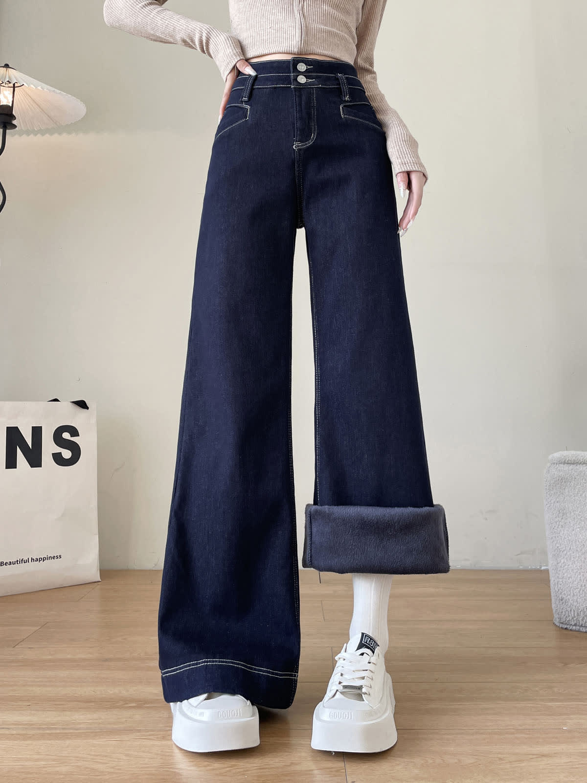 YEEYEEWang Wide-Leg Jeans in Denim Blue, Fleece-Lined, Asian-fit cut, waist-down front standing pose, one hem rolled up revealing fleece lining inside.