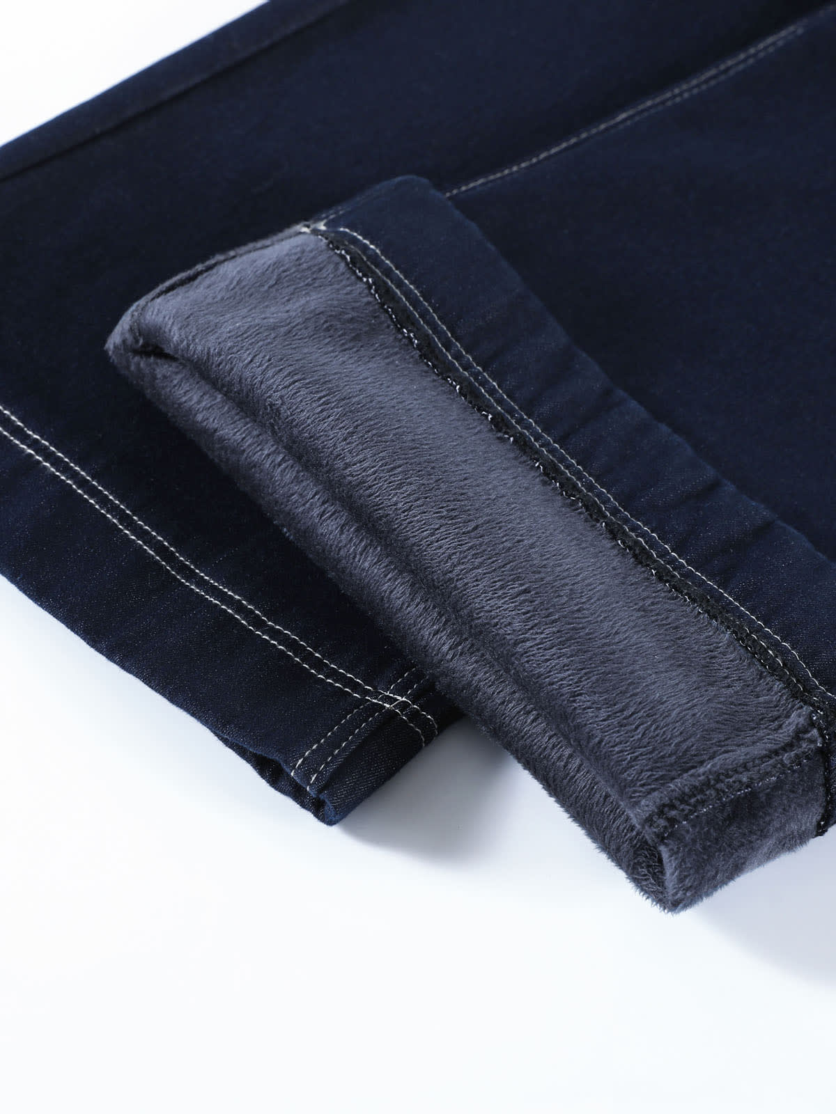 YEEYEEWang Wide-Leg Jeans in Denim Blue, Fleece-Lined, Asian-fit cut, close-up of hem rolled up showing plush fleece lining texture and contrast stitching.