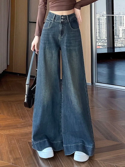 YEEYEEWang wide-leg jeans in Mid-Wash Blue, Asian-fit cut, waist-down front view holding black handbag, cuffed hems over white sneakers, variant thumbnail.