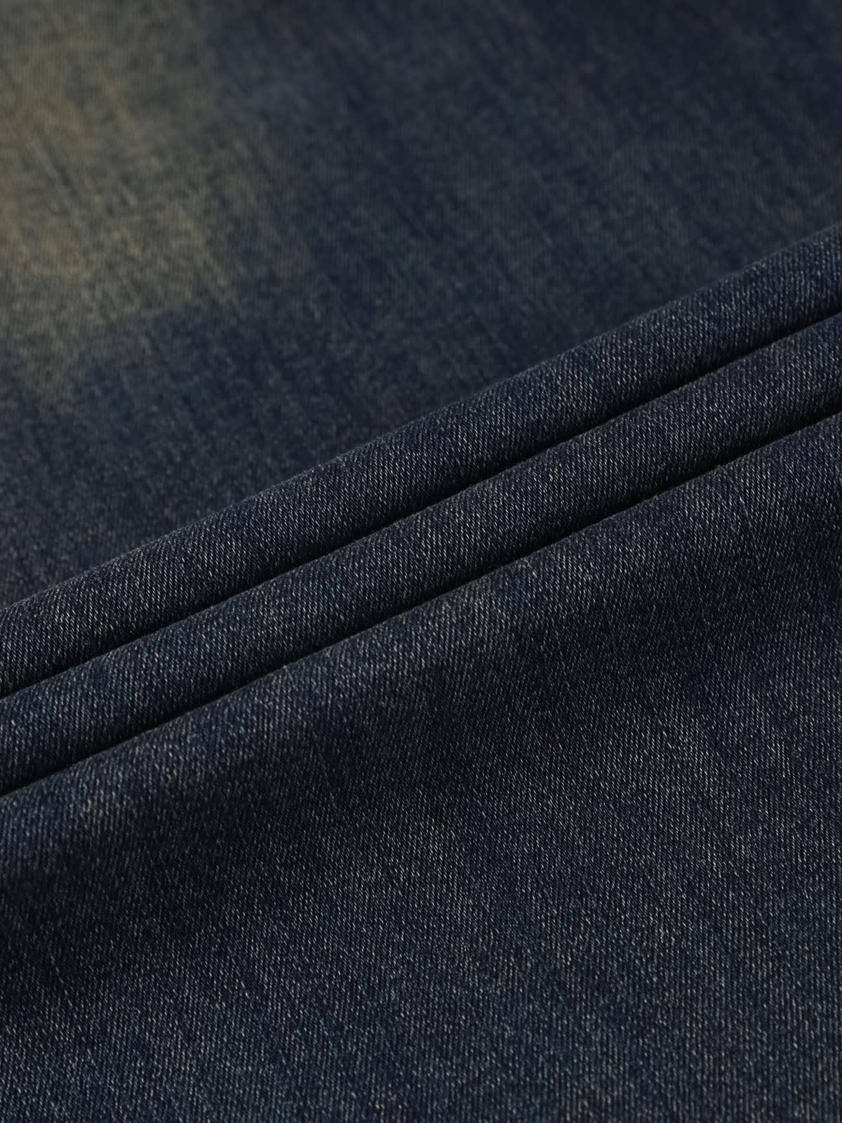 YEEYEEWang wide-leg jeans in Mid-Wash Blue, Asian-fit cut, close-up of soft denim texture with natural folds and fine twill weave.