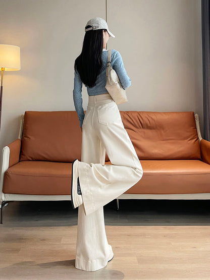 YEEYEEWang wide-leg jeans in Ivory, Asian-fit cut, full-body back leg-kick pose with beige shoulder bag, back patch pockets visible.