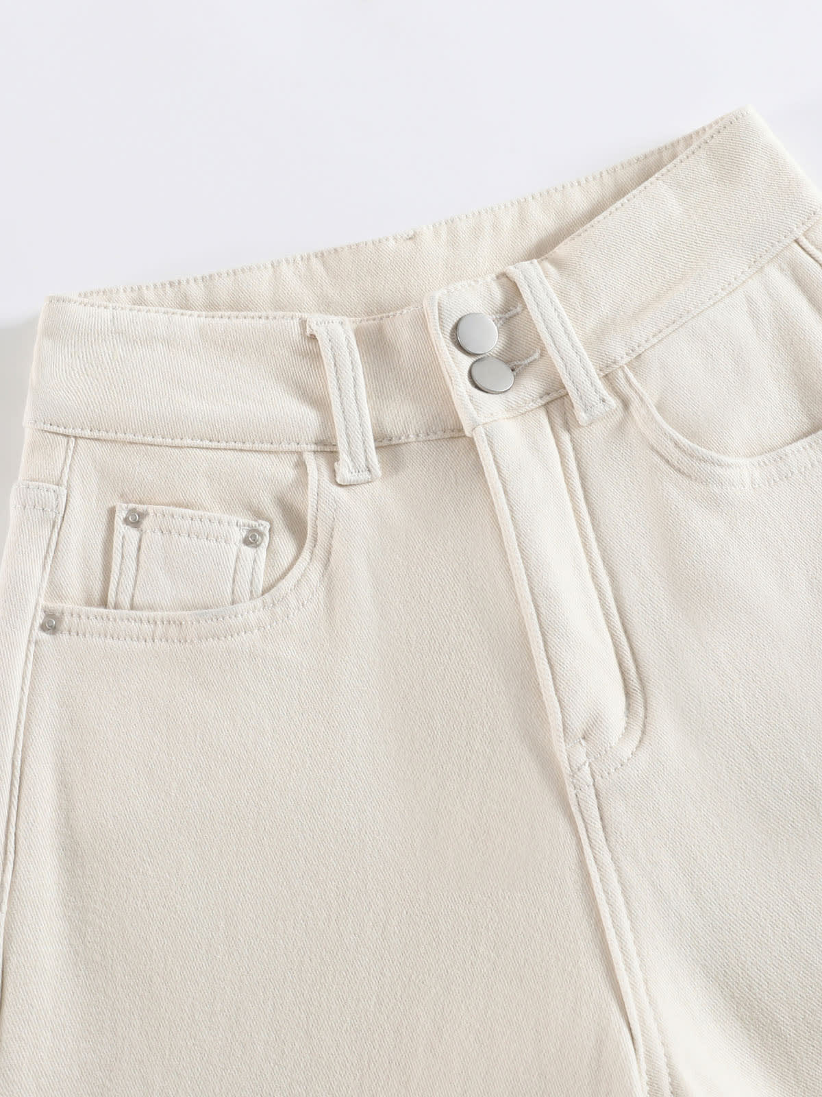 YEEYEEWang wide-leg jeans in Ivory, Asian-fit cut, close-up of double metal button waistband, coin pocket and clean stitching on cream denim.