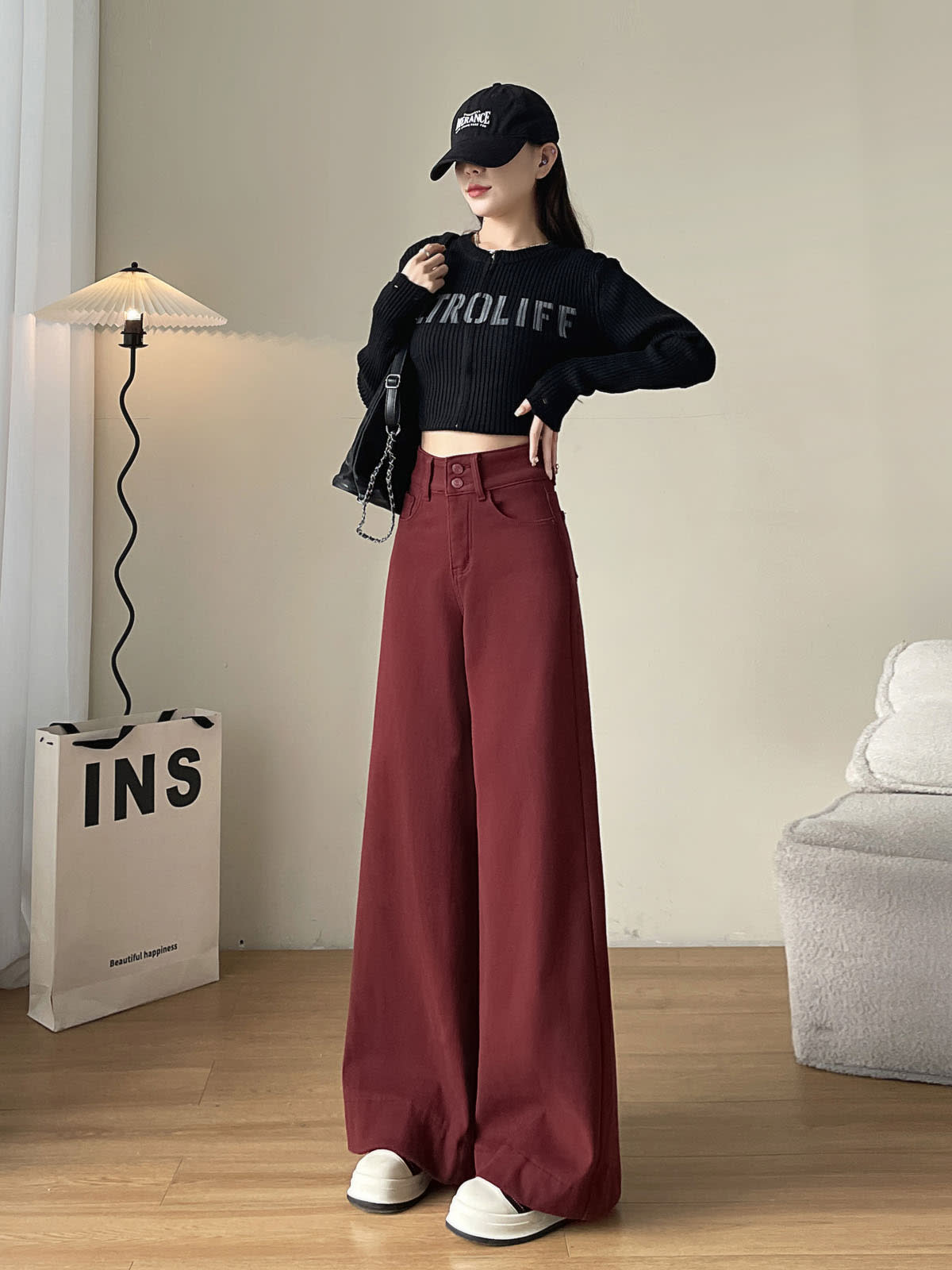 YEEYEEWang wide-leg jeans in Dark Cherry, Asian-fit cut, full-body standing front pose in black cap, hand near shoulder, chain bag at side.