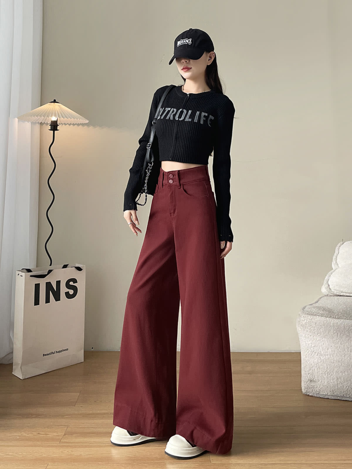 YEEYEEWang wide-leg jeans in Dark Cherry, Asian-fit cut, full-body side-front standing pose in black cap and letter knit, chain bag on shoulder.