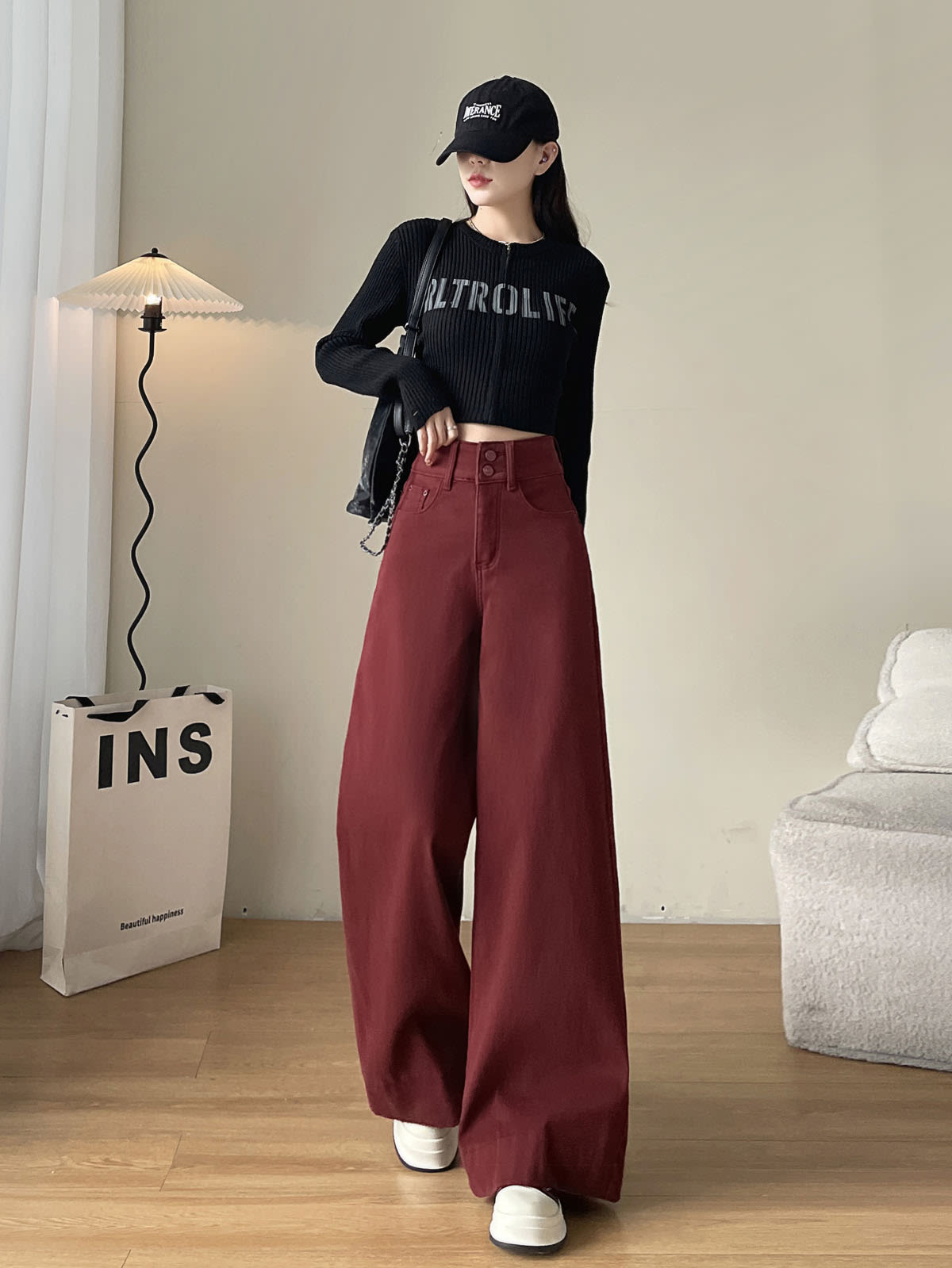 YEEYEEWang wide-leg jeans in Dark Cherry, Asian-fit cut, full-body standing front pose in black cap, hand resting on the waistband, floor-sweeping wide legs.
