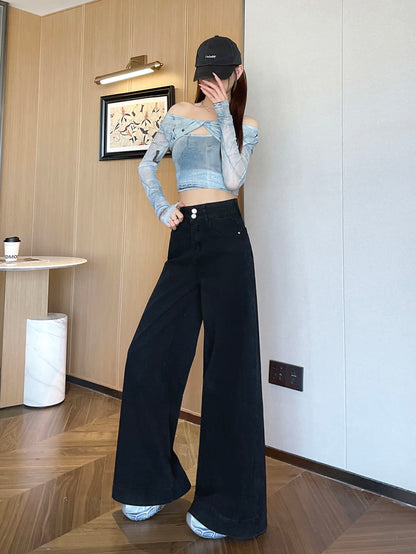 YEEYEEWang wide-leg jeans in Solid Black, Asian-fit cut, full-body standing pose in black cap, hand touching face, wood-paneled wall backdrop.