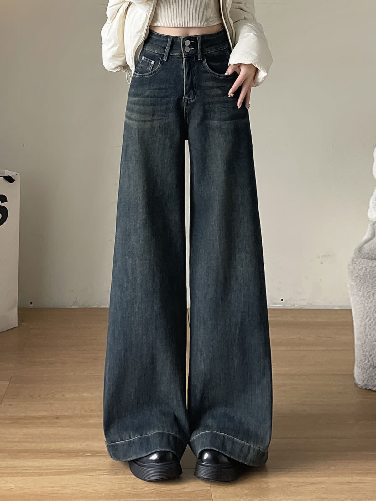YEEYEEWang Fleece-Lined Wide-Leg Jeans in Mid-Wash Blue, waist-down front standing view with floor-sweeping drape over platform shoes, Asian-fit cut.