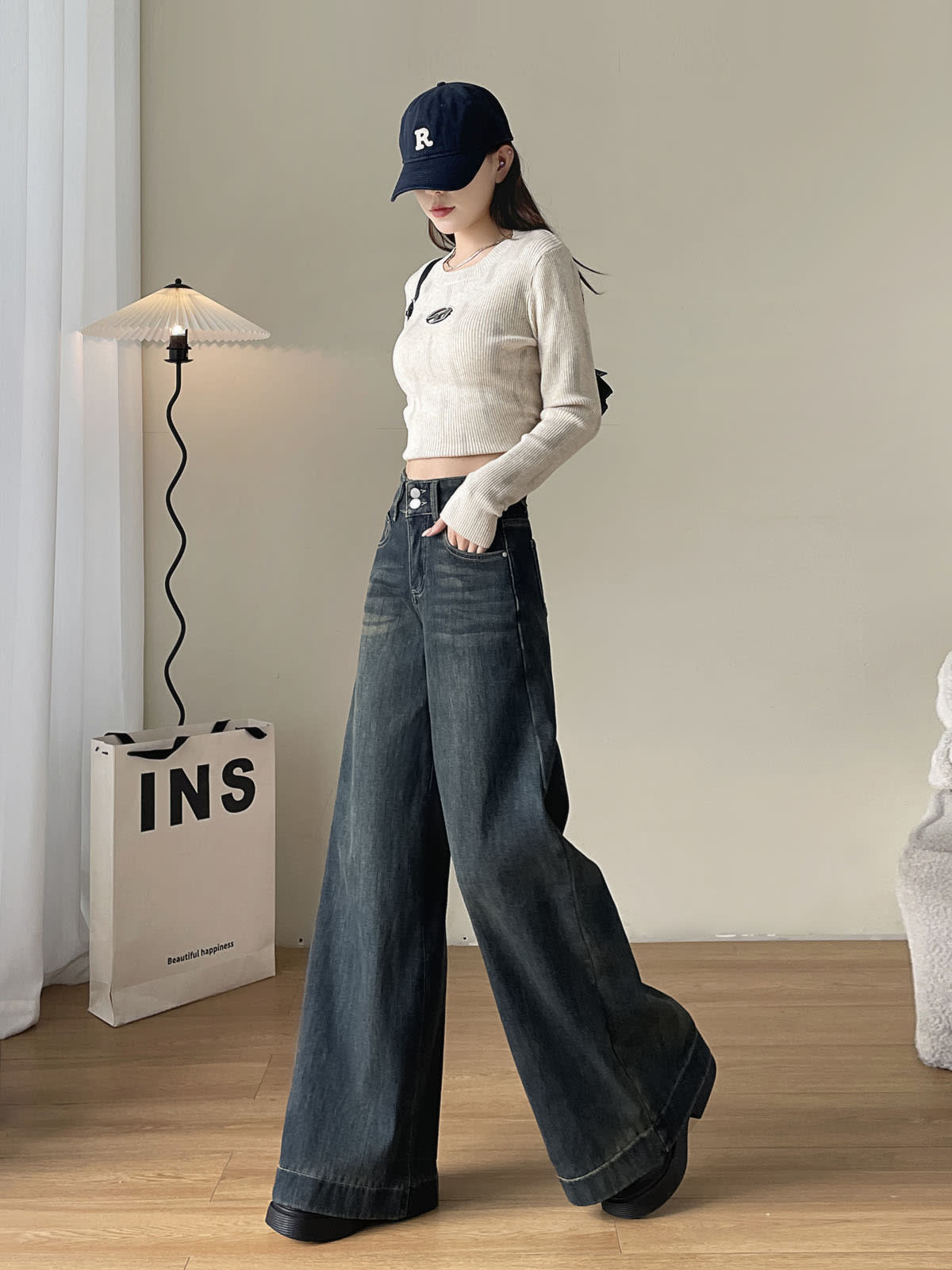 YEEYEEWang Fleece-Lined Wide-Leg Jeans in Mid-Wash Blue, full-body front walking pose in navy cap and ribbed crop top, hand in pocket, Asian-fit cut.