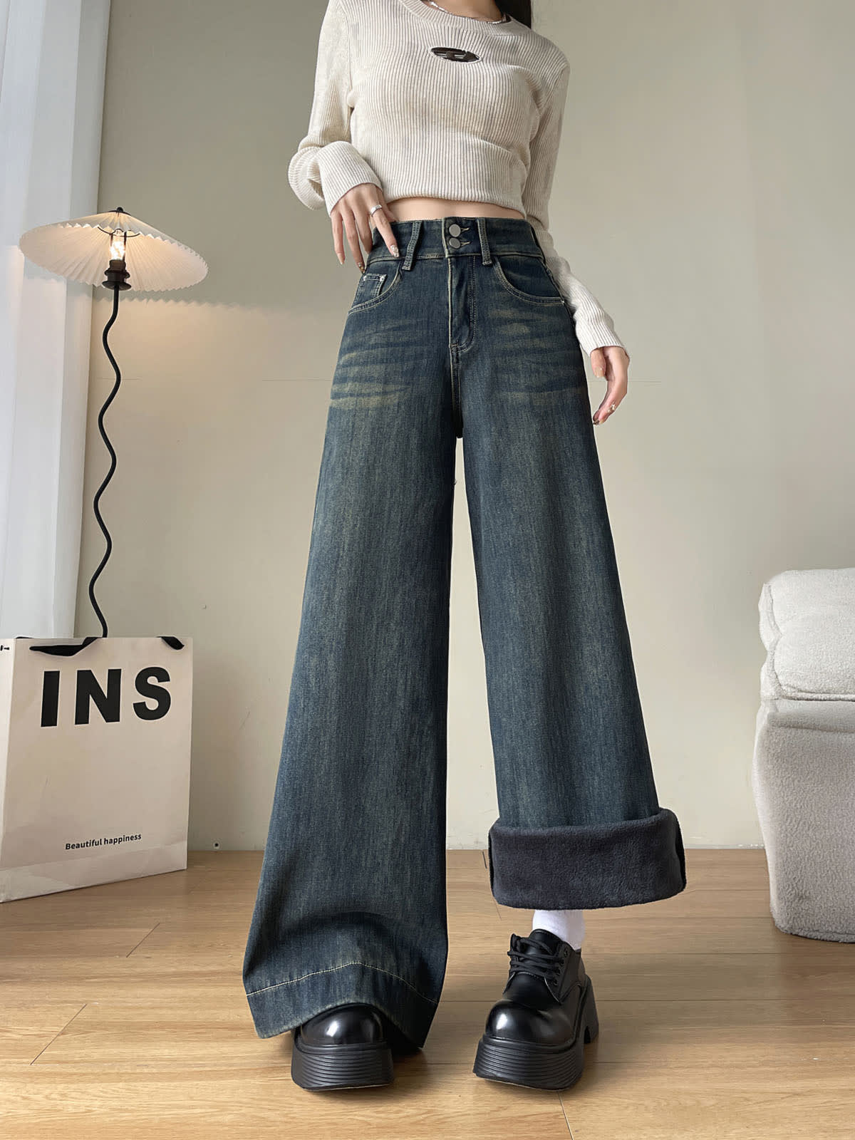 YEEYEEWang Fleece-Lined Wide-Leg Jeans in Mid-Wash Blue, full-body front standing view, one cuff folded up showing plush fleece lining, Asian-fit cut.