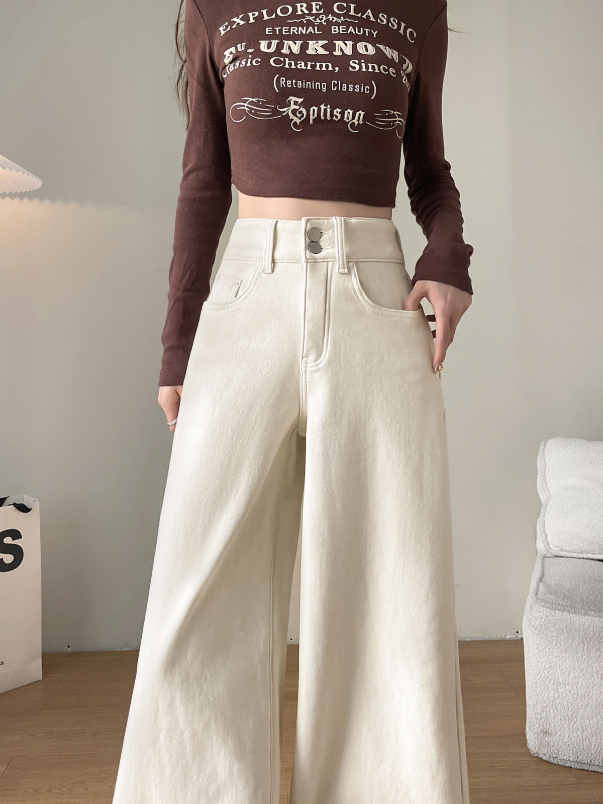 YEEYEEWang Fleece-Lined Wide-Leg Jeans in Ivory, waist-down front view, double metal buttons and curved front pockets on clean ecru denim, Asian-fit cut.
