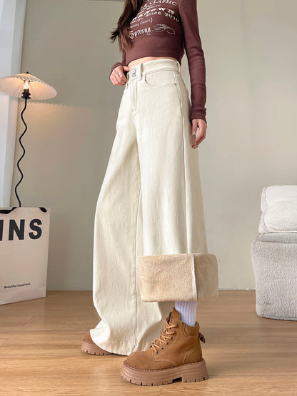 YEEYEEWang Fleece-Lined Wide-Leg Jeans in Ivory, full-body side standing view, one cuff folded up showing cream fleece lining, tan lace-up boots, Asian-fit cut.