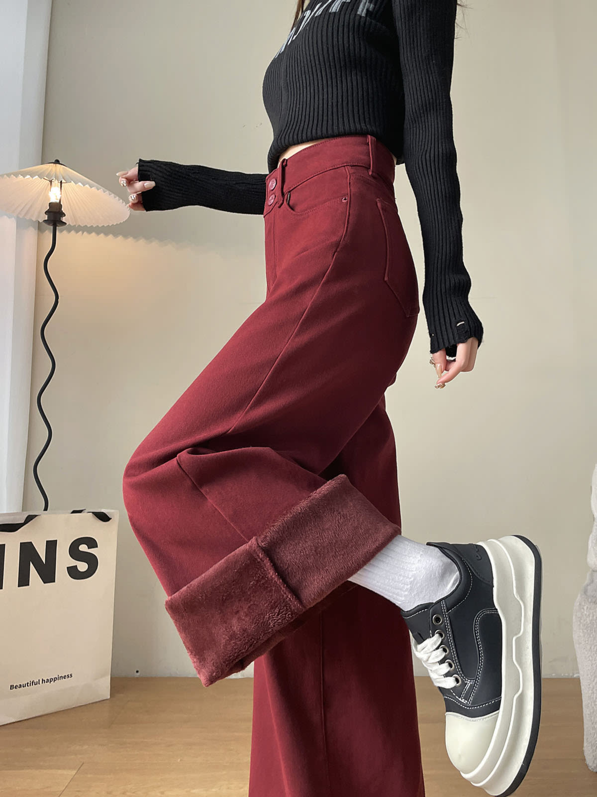 YEEYEEWang Fleece-Lined Wide-Leg Jeans in Dark Cherry, half-body side view with leg-kick pose, folded cuff revealing plush fleece lining, Asian-fit cut.