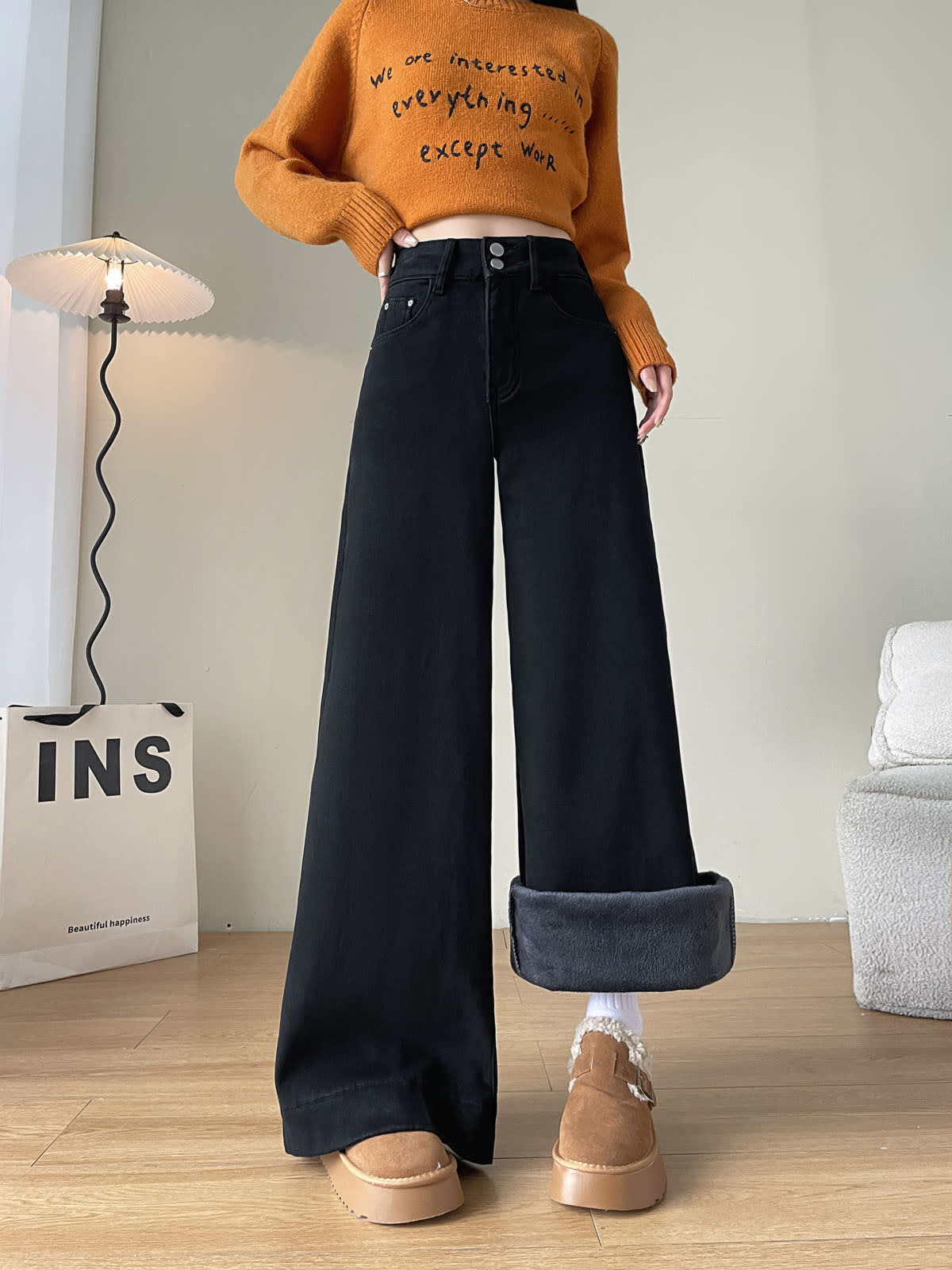 YEEYEEWang Fleece-Lined Wide-Leg Jeans in Solid Black, full-body front standing view, one cuff folded up showing grey fleece lining, Asian-fit cut.